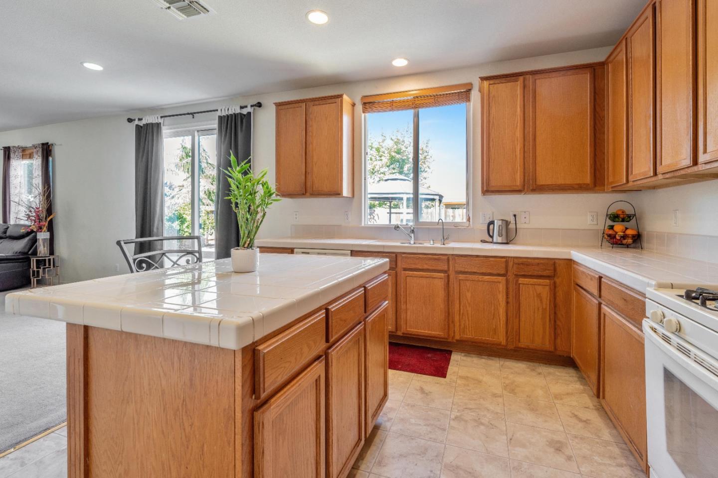 1433 Brahma Street Patterson, CA 95363 - Photo 14 of 43 a kitchen with a sink stove and cabinets