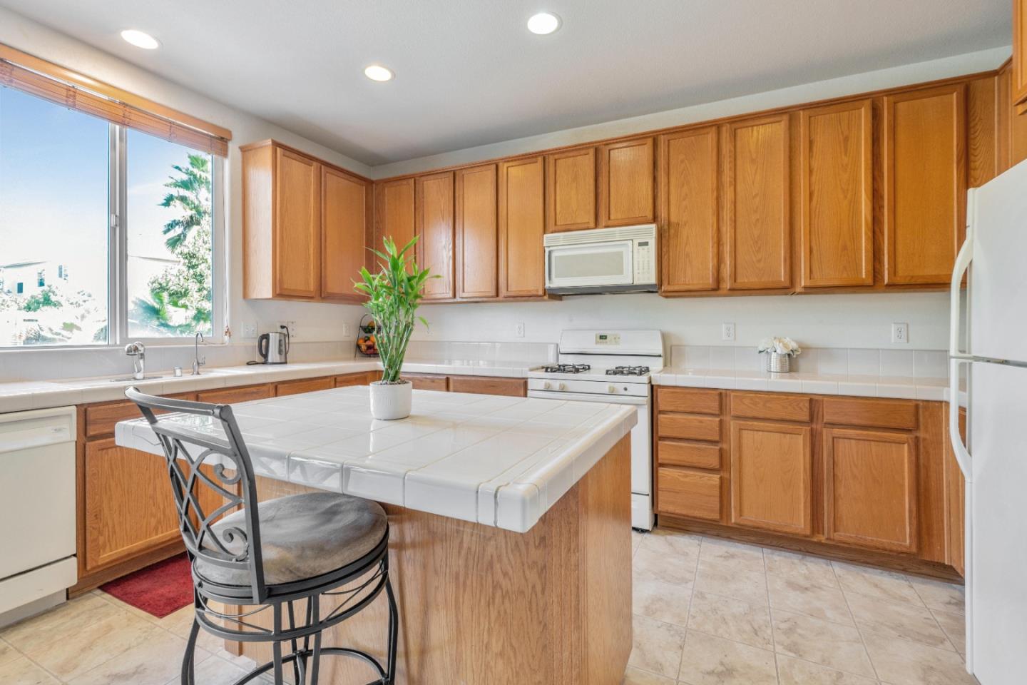 1433 Brahma Street Patterson, CA 95363 - Photo 15 of 43 a kitchen with a stove a sink and a refrigerator