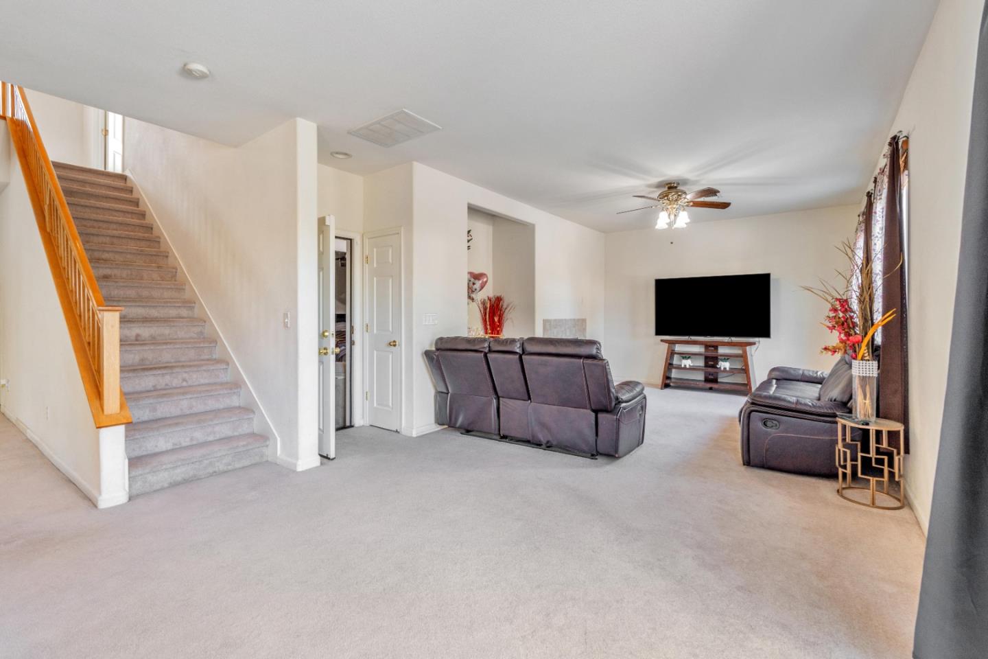 1433 Brahma Street Patterson, CA 95363 - Photo 20 of 43 a living room with furniture and a flat screen tv