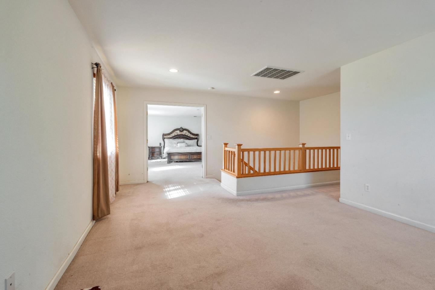 1433 Brahma Street Patterson, CA 95363 - Photo 21 of 43 a view of a hallway with a large window and livingroom view