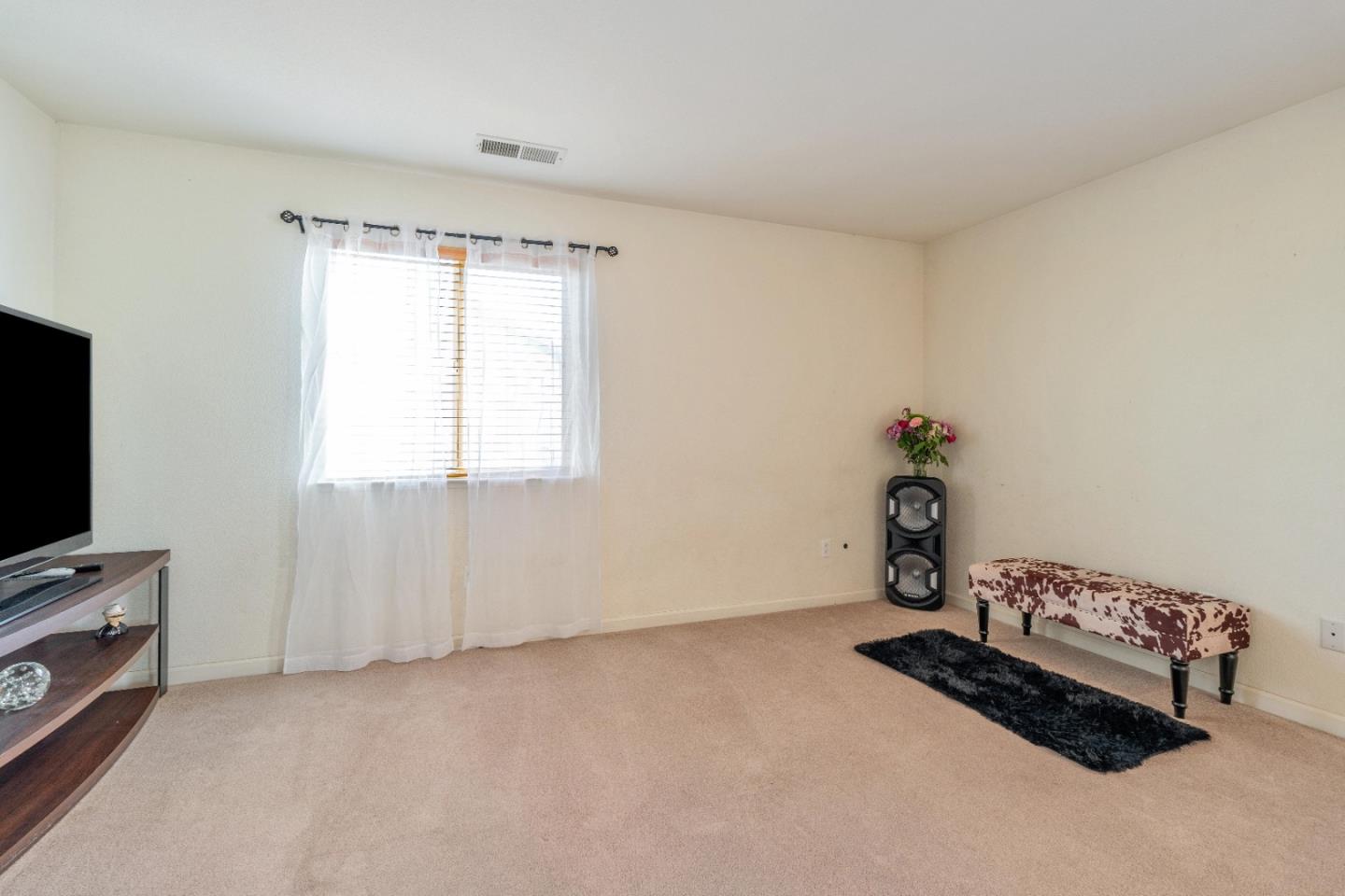 1433 Brahma Street Patterson, CA 95363 - Photo 23 of 43 a room with window and a flat screen tv