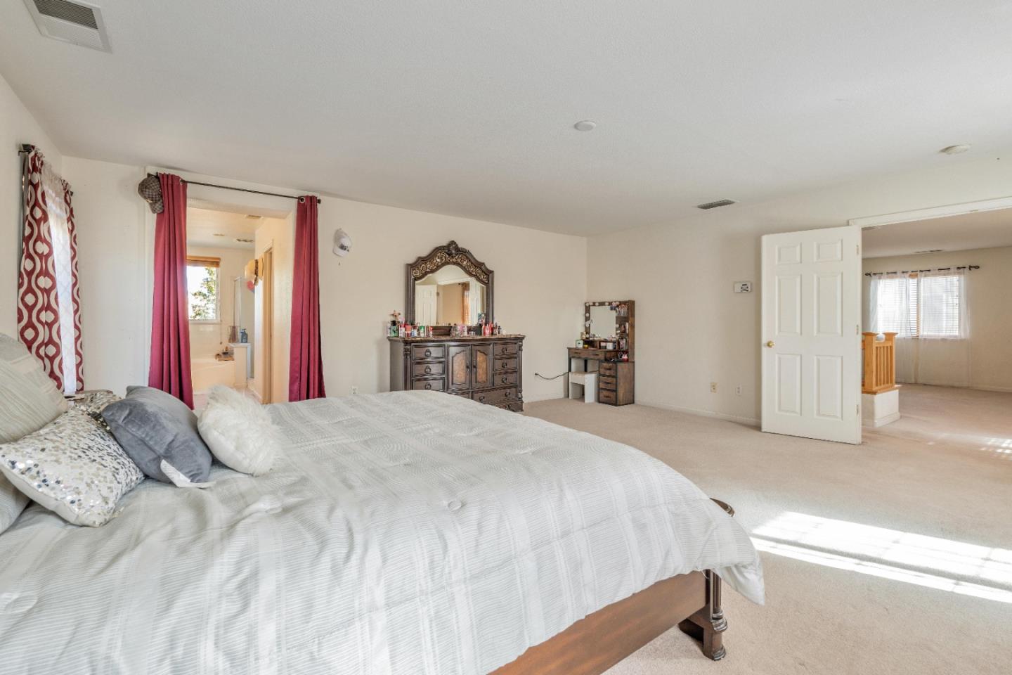 1433 Brahma Street Patterson, CA 95363 - Photo 26 of 43 a bedroom with a large bed and a dresser