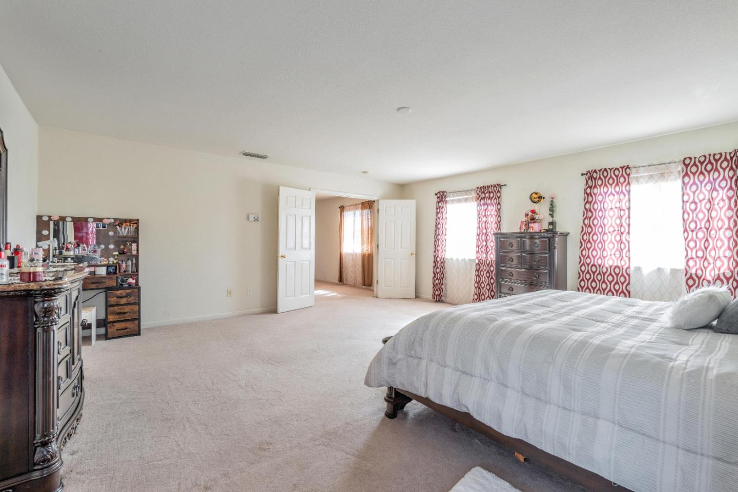 1433 Brahma Street Patterson, CA 95363 - Photo 27 of 43 a bedroom with a bed and a large window