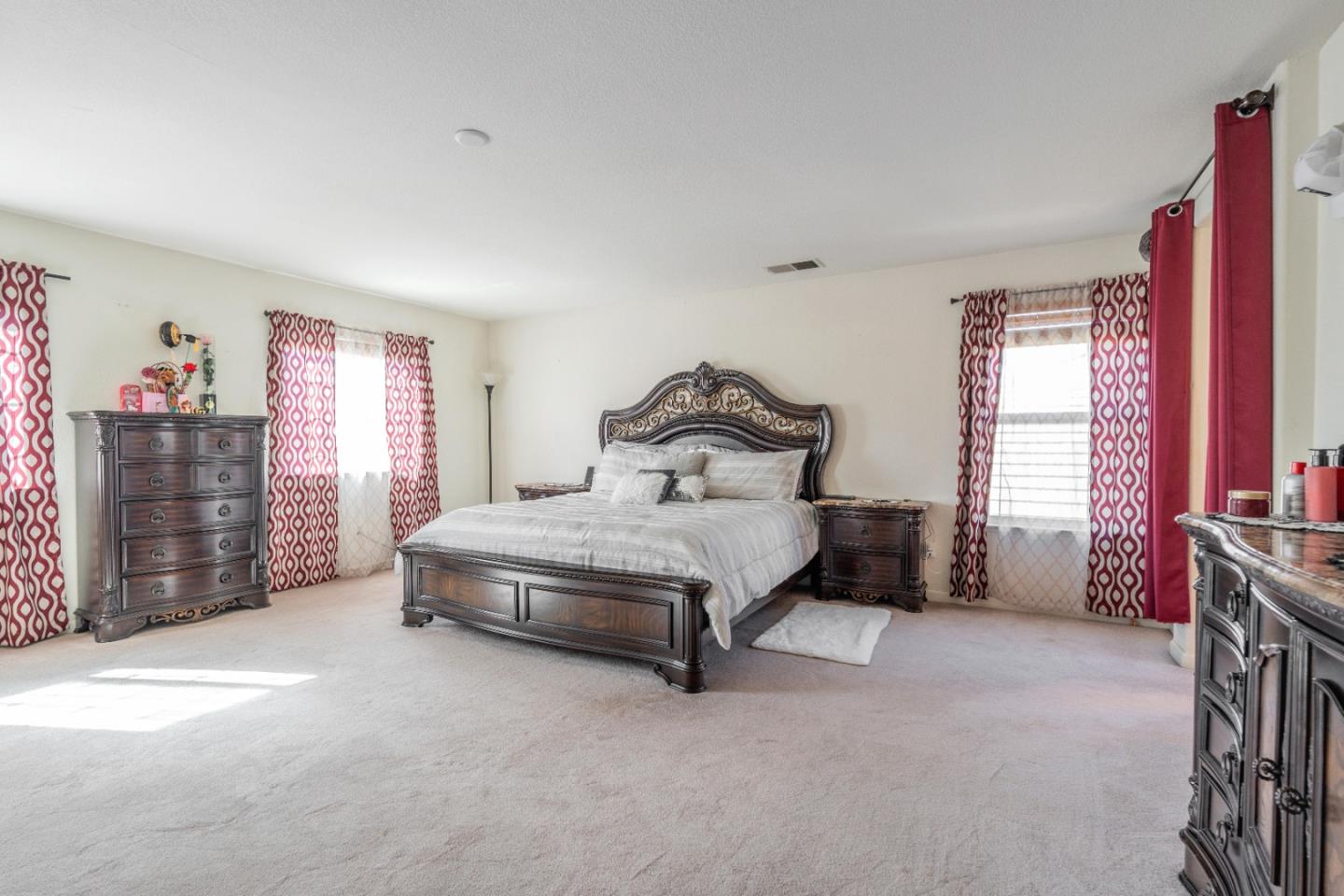 1433 Brahma Street Patterson, CA 95363 - Photo 28 of 43 a spacious bedroom with a bed and a cabinets