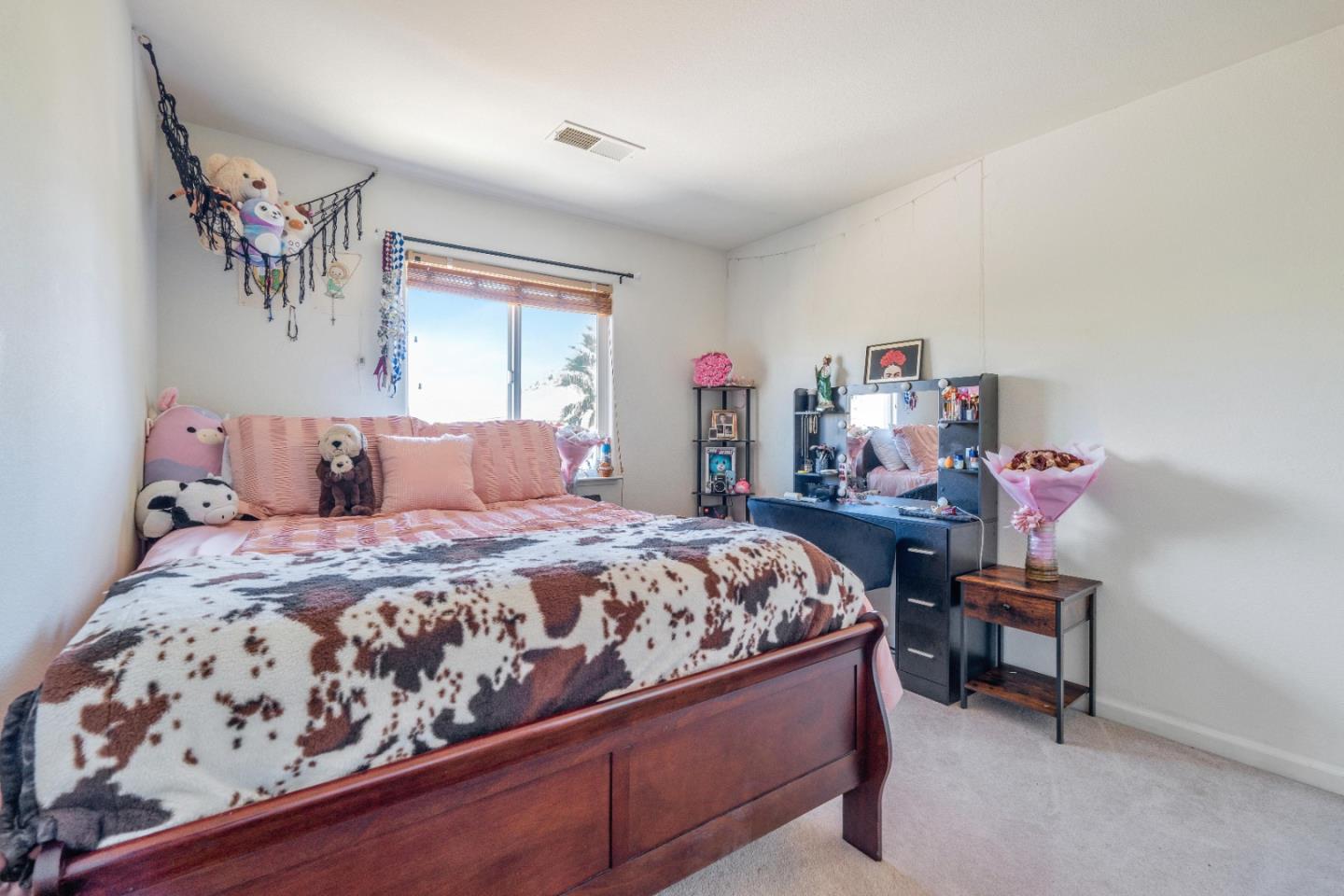 1433 Brahma Street Patterson, CA 95363 - Photo 29 of 43 a bedroom with a bed and a table in it