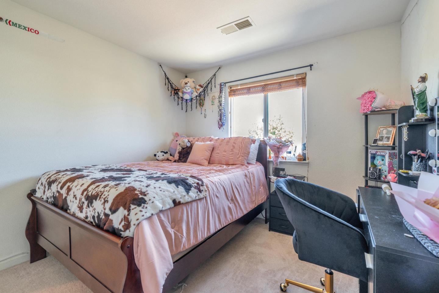 1433 Brahma Street Patterson, CA 95363 - Photo 30 of 43 a bedroom with bed and a window