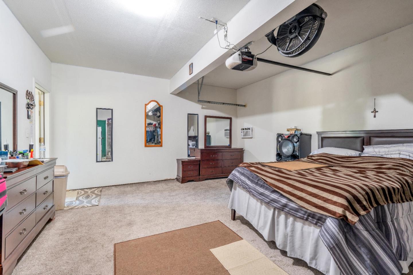 1433 Brahma Street Patterson, CA 95363 - Photo 34 of 43 a bedroom with bed and a chandelier