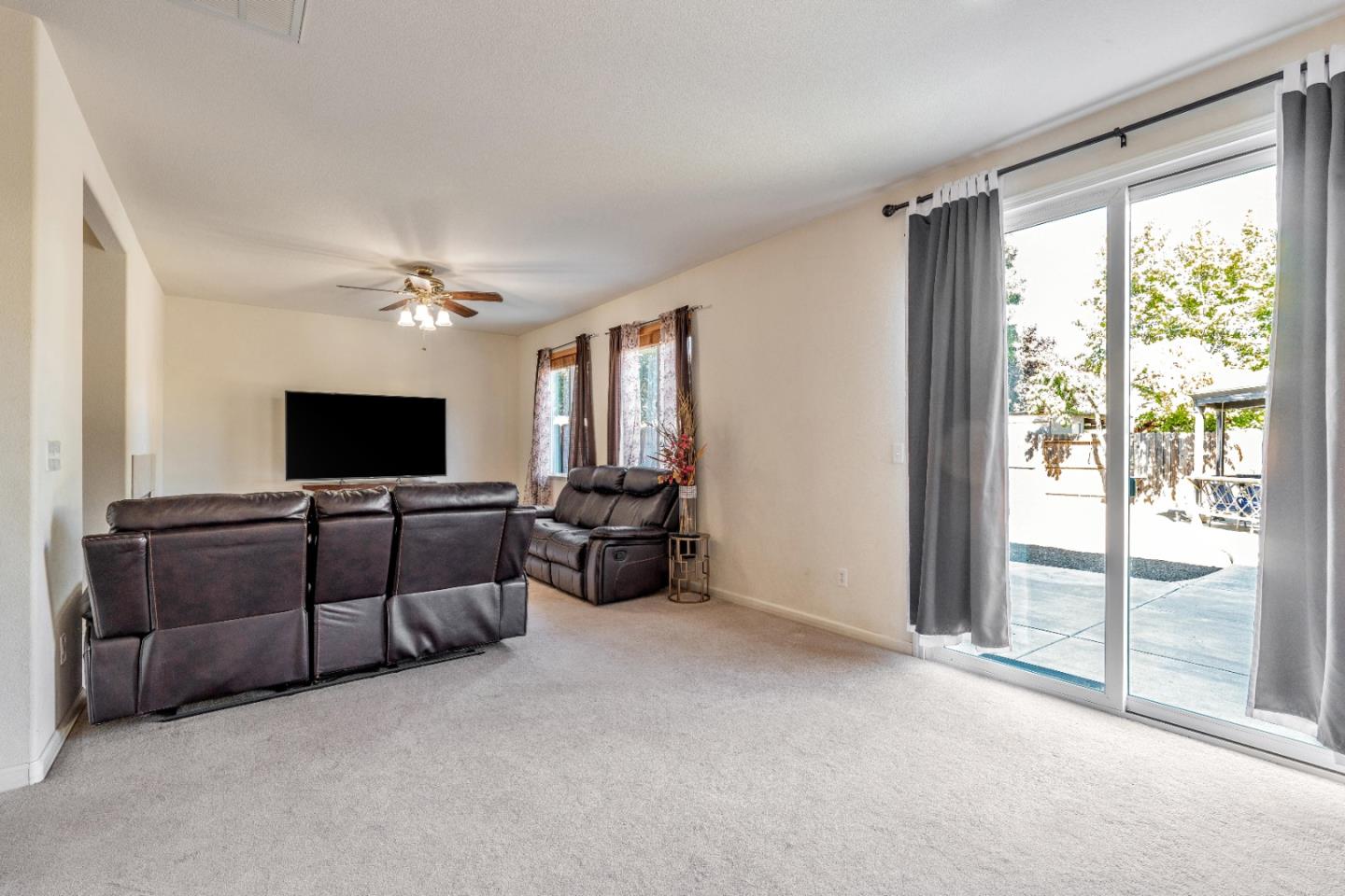 1433 Brahma Street Patterson, CA 95363 - Photo 4 of 43 a living room with furniture and a flat screen tv