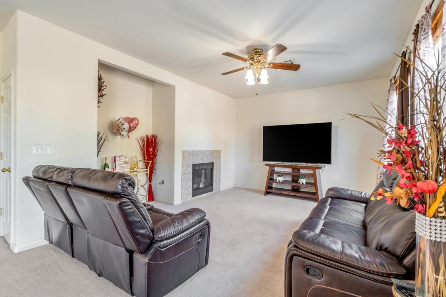 1433 Brahma Street Patterson, CA 95363 - Photo 5 of 43 a living room with furniture and a flat screen tv