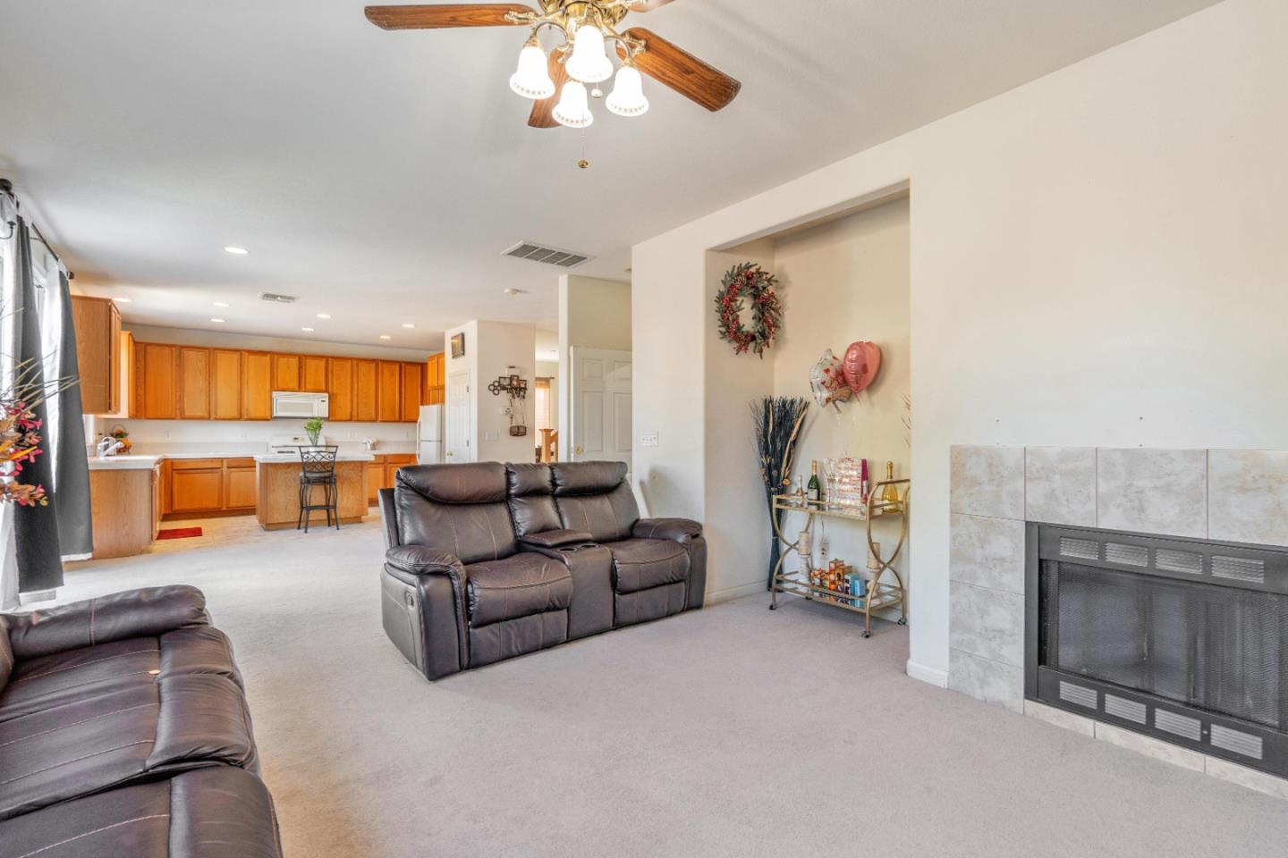 1433 Brahma Street Patterson, CA 95363 - Photo 8 of 43 a living room with furniture and a fireplace