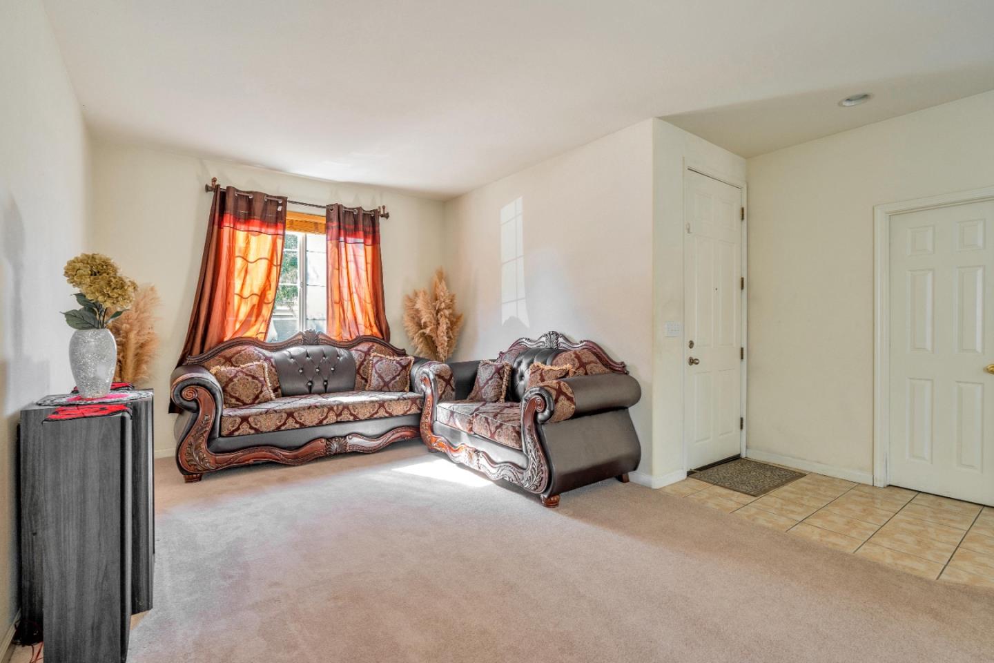 1433 Brahma Street Patterson, CA 95363 - Photo 9 of 43 a living room with furniture and a flat screen tv