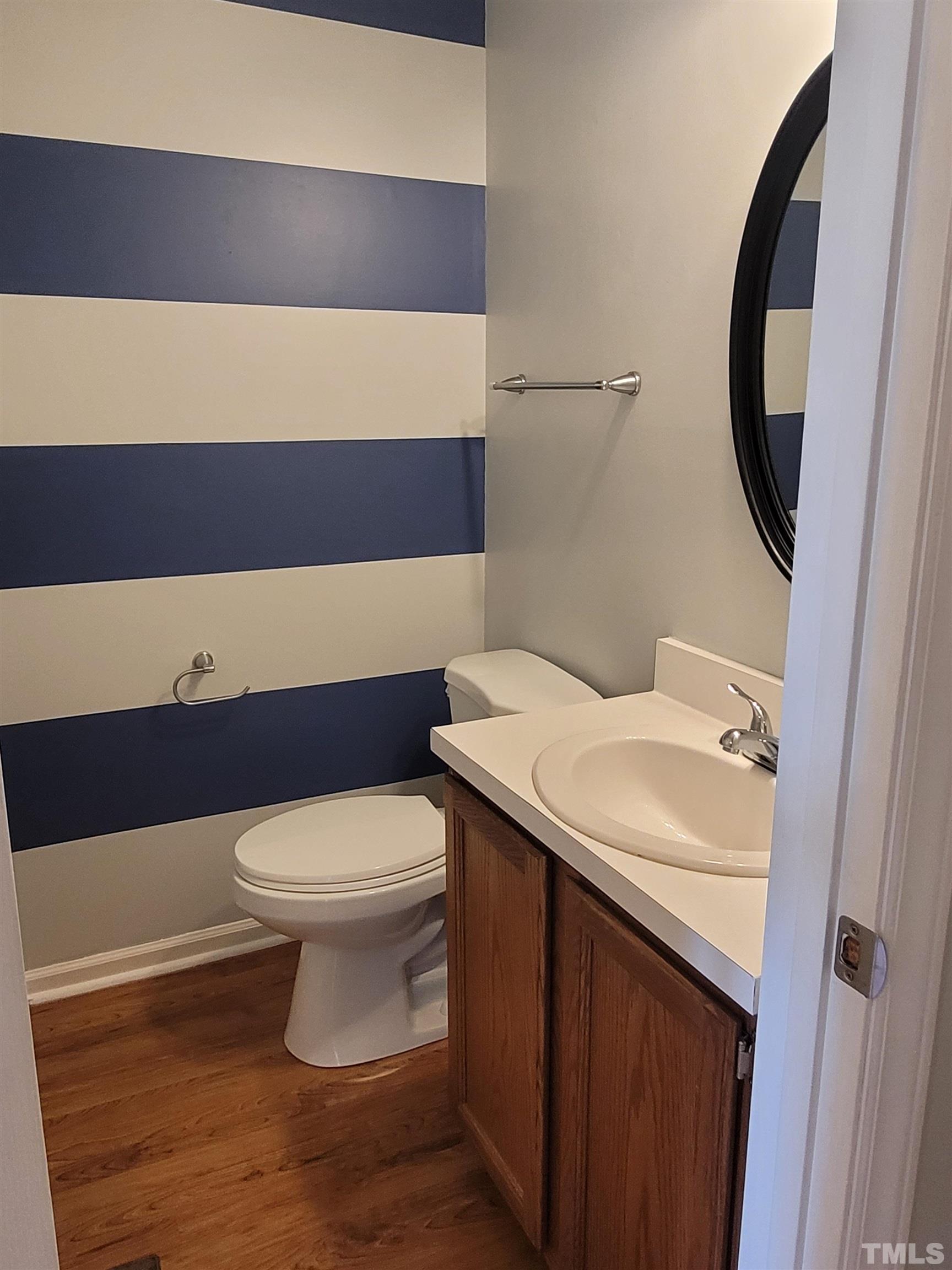 4836 Draper Road Raleigh, NC 27616 - Photo 9 of 16 a bathroom with a sink and a toilet