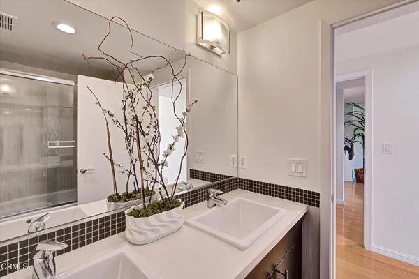 a bathroom with a shower and a toilet