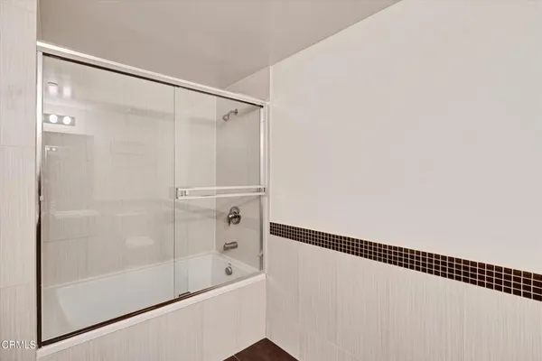 a bedroom with a bed and a window with outer view