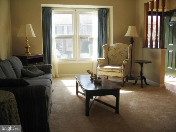 6278 Rathlin Drive Springfield, VA 22152 - Photo 16 of 25 a living room with furniture and a window