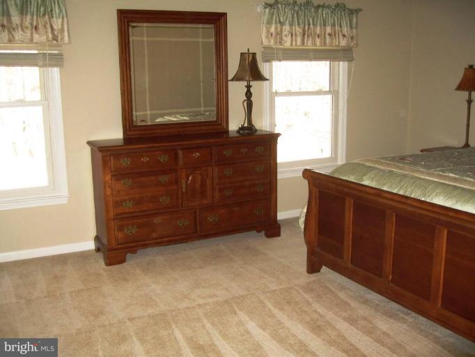 6278 Rathlin Drive Springfield, VA 22152 - Photo 18 of 25 a room with a dresser and a window