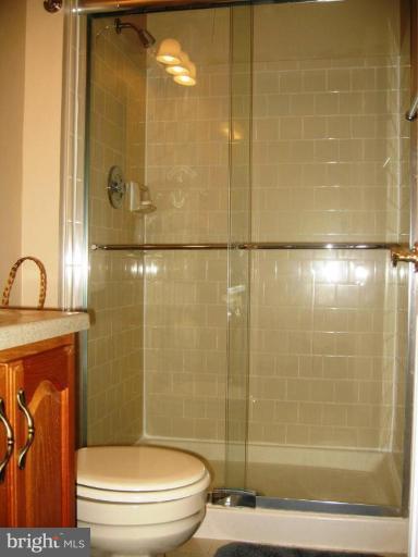 6278 Rathlin Drive Springfield, VA 22152 - Photo 3 of 25 a bathroom with a shower a toilet and a sink