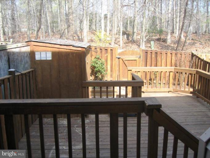 6278 Rathlin Drive Springfield, VA 22152 - Photo 5 of 25 a view of a chairs and table in the balcony