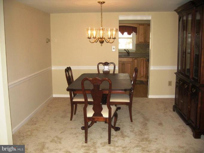6278 Rathlin Drive Springfield, VA 22152 - Photo 6 of 25 a view of a dining room with furniture window and wooden floor