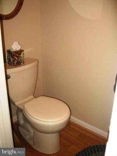 6278 Rathlin Drive Springfield, VA 22152 - Photo 10 of 25 a white toilet sitting next to a sink