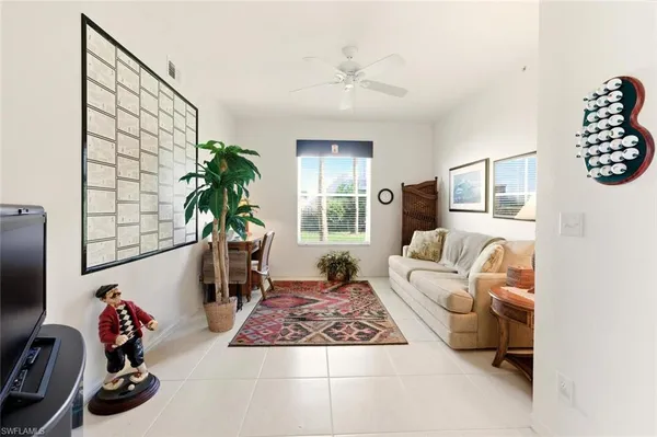 a living room with furniture and a window