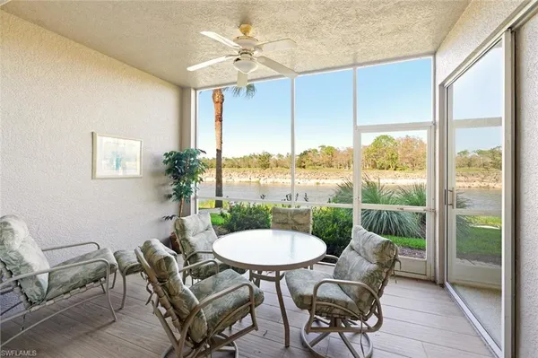 a balcony with furniture and a window