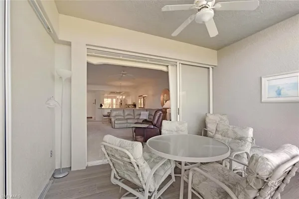 a dining room with furniture and chandelier