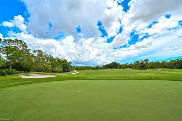 a view of a golf course with a lake