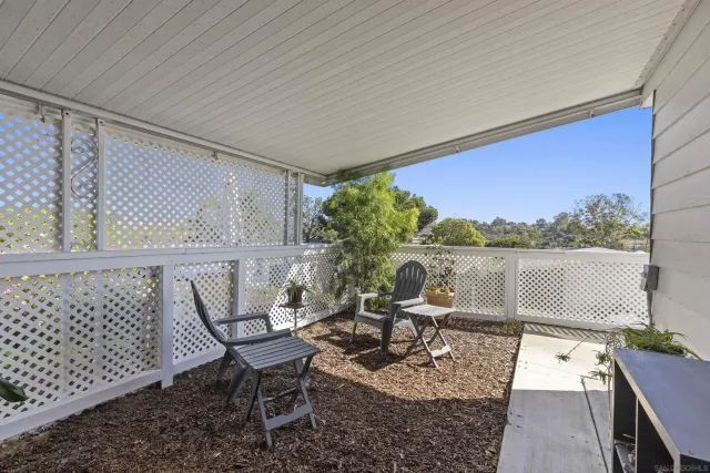 a living room with furniture a window and a table