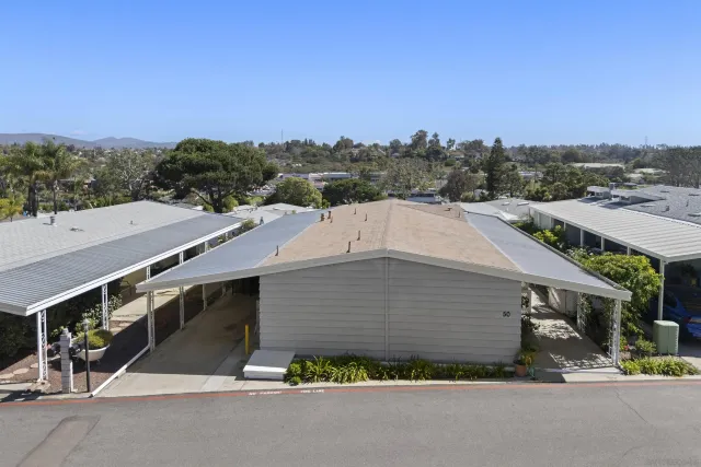 a aerial view of a house with a yard and garage