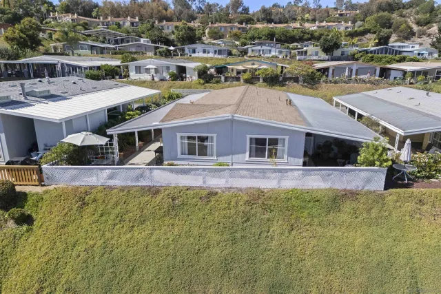 a aerial view of a house with a swimming pool