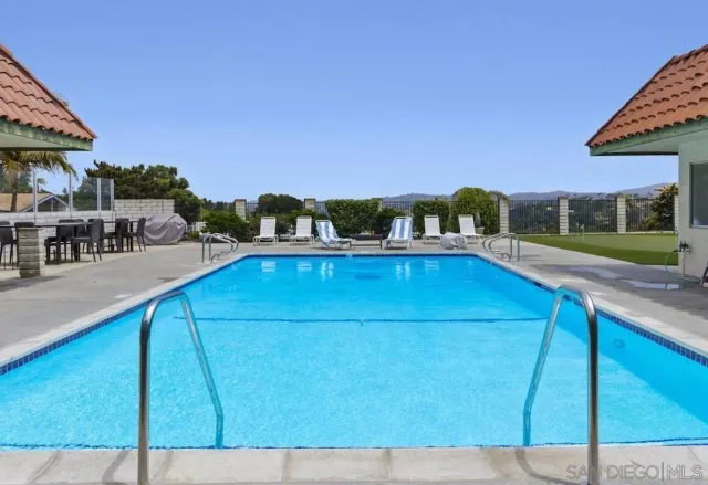 a view of a swimming pool with a patio