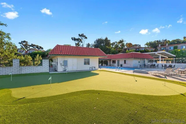 a view of a house with a swimming pool
