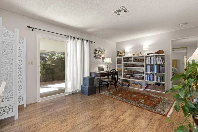 a view of a livingroom with furniture and window