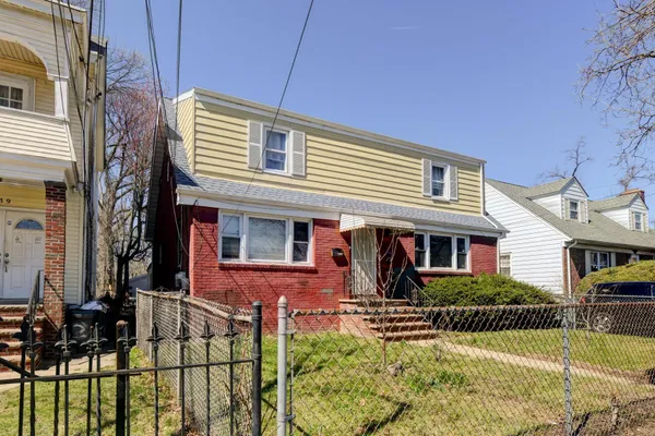 front view of a house with swimming pool