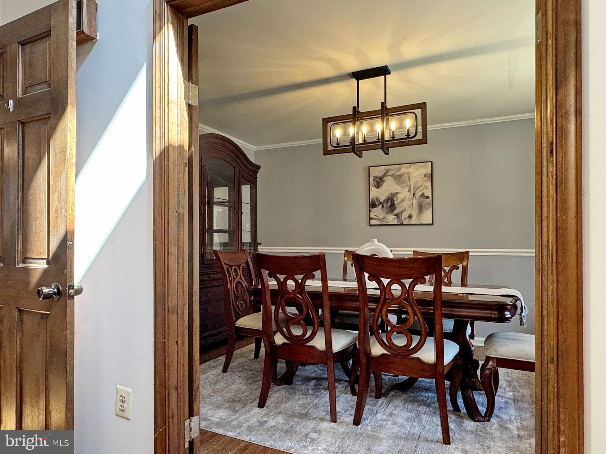 8150 Plowden Drive La Plata, MD 20646 - Photo 12 of 91 a view of a dining room with furniture and chandelier