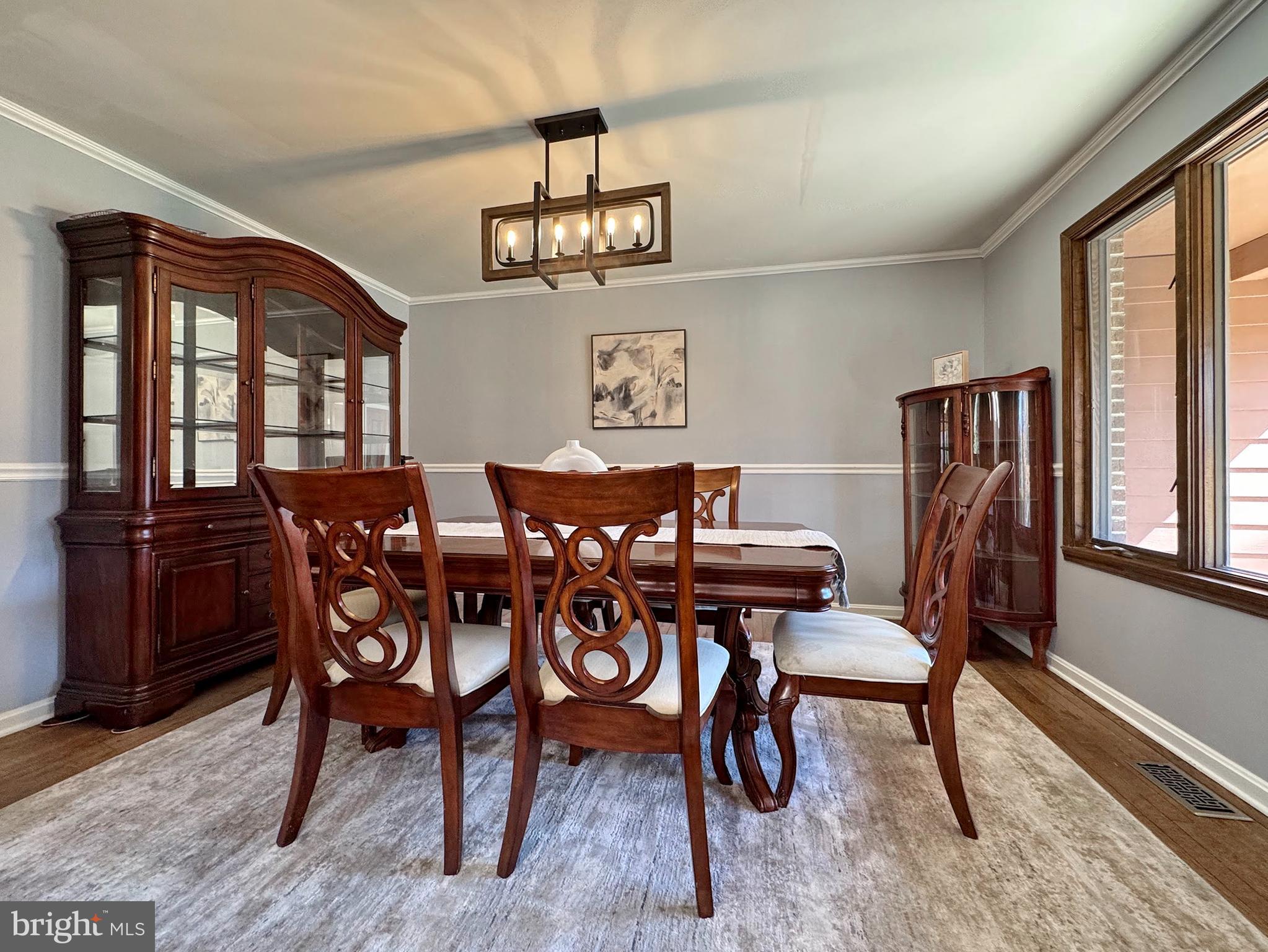 8150 Plowden Drive La Plata, MD 20646 - Photo 13 of 91 a view of a dining room with furniture window and wooden floor
