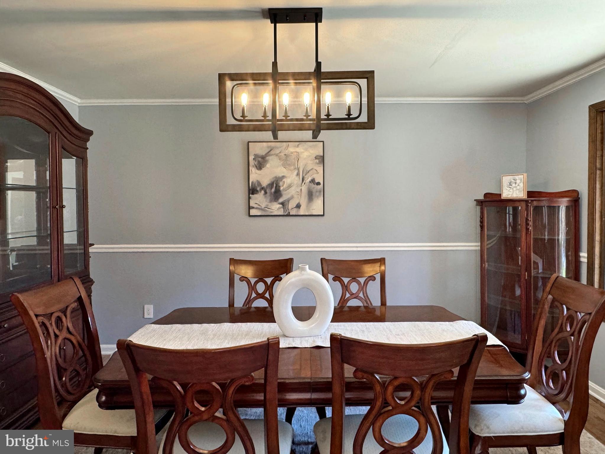 8150 Plowden Drive La Plata, MD 20646 - Photo 14 of 91 a view of a dining room with furniture and chandelier