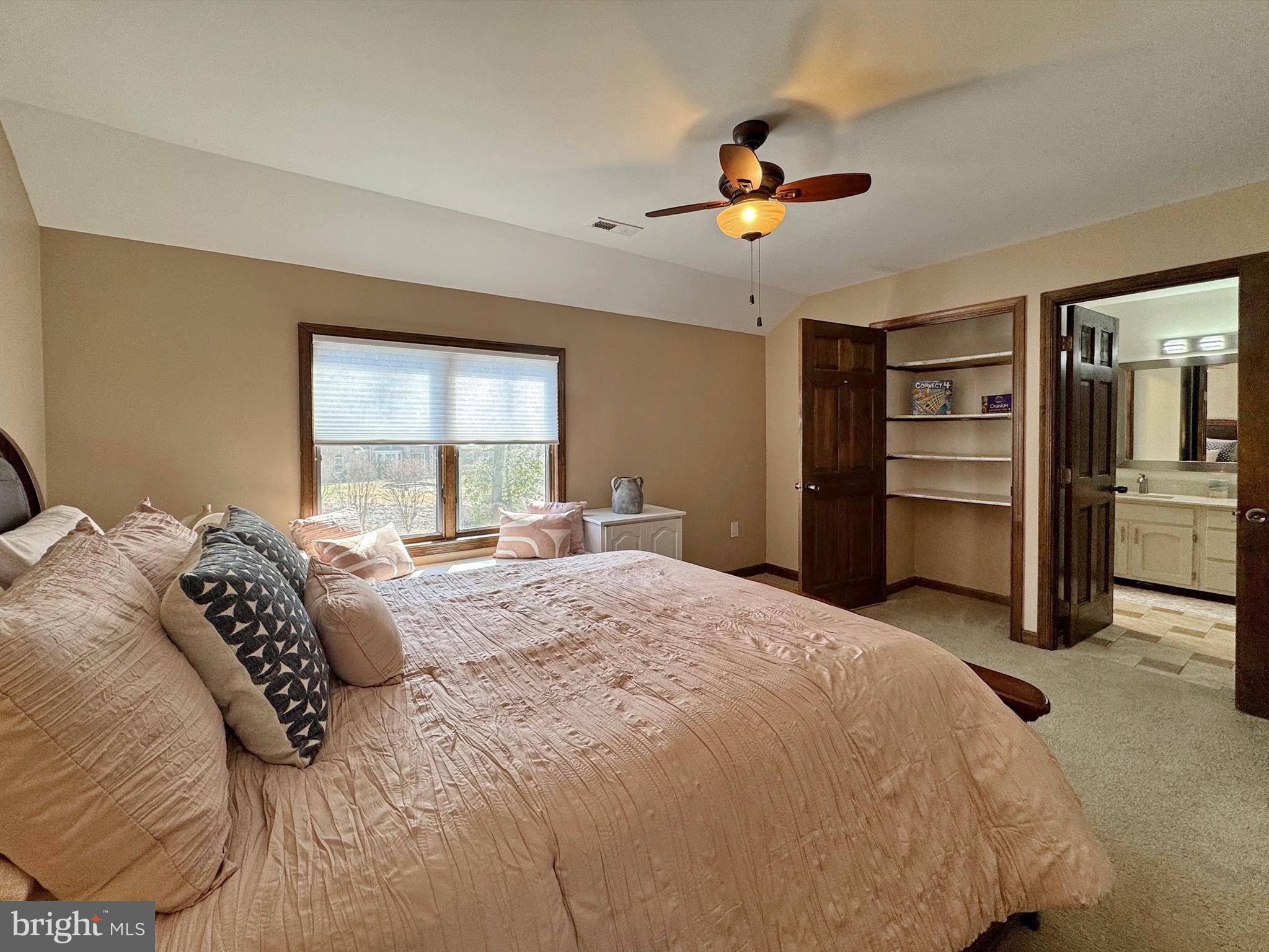 8150 Plowden Drive La Plata, MD 20646 - Photo 55 of 91 a bedroom with a large bed and a chandelier