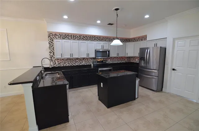 a kitchen with a sink and cabinets