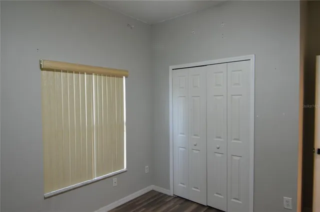 a white toilet sitting next to a shower