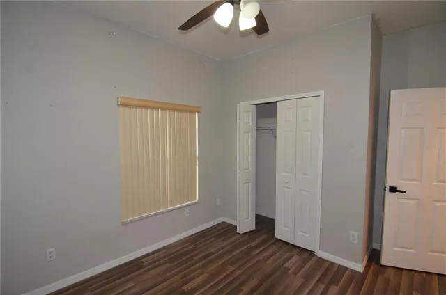 a view of hallway with wooden floor