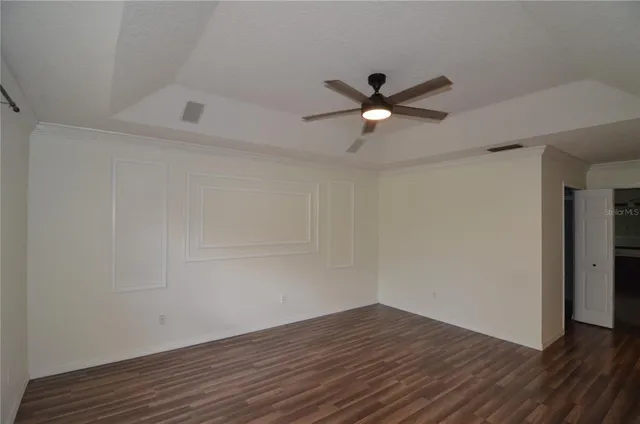 a kitchen with a sink cabinets and a window
