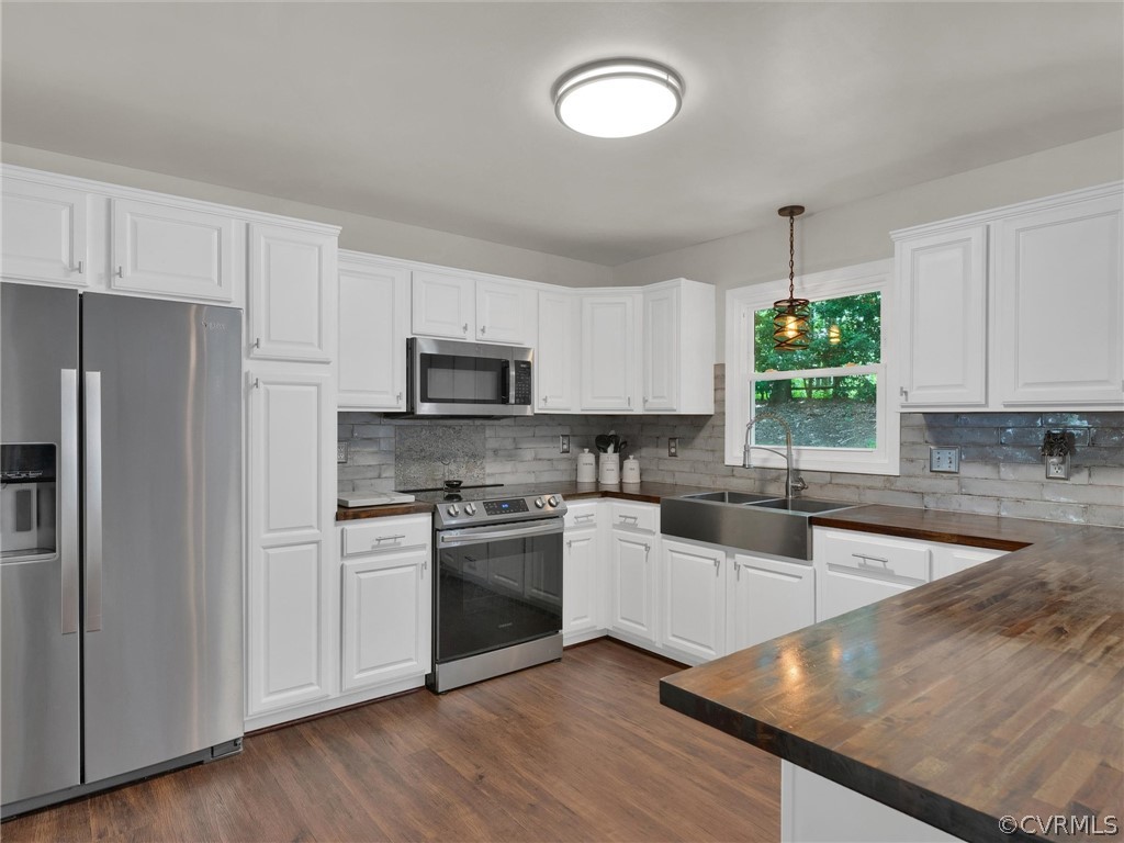 14307 Long Gate Road Midlothian, VA 23112 - Photo 12 of 41 a kitchen with stainless steel appliances granite countertop a stove a sink and a refrigerator