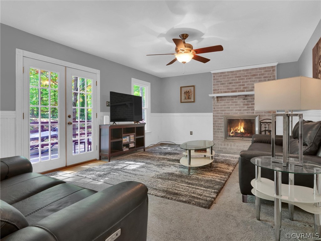 14307 Long Gate Road Midlothian, VA 23112 - Photo 18 of 41 a living room with furniture a fireplace and a flat screen tv