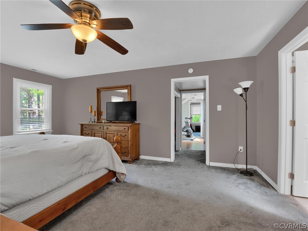 14307 Long Gate Road Midlothian, VA 23112 - Photo 22 of 41 a bedroom with a bed and a flat tv screen on the dresser