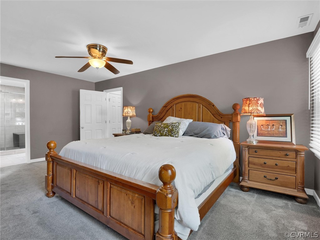 14307 Long Gate Road Midlothian, VA 23112 - Photo 24 of 41 a bedroom with a bed and a chandelier