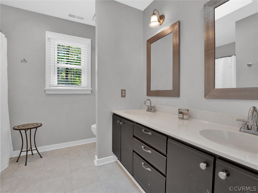 14307 Long Gate Road Midlothian, VA 23112 - Photo 30 of 41 a bathroom with a double vanity sink a mirror and a