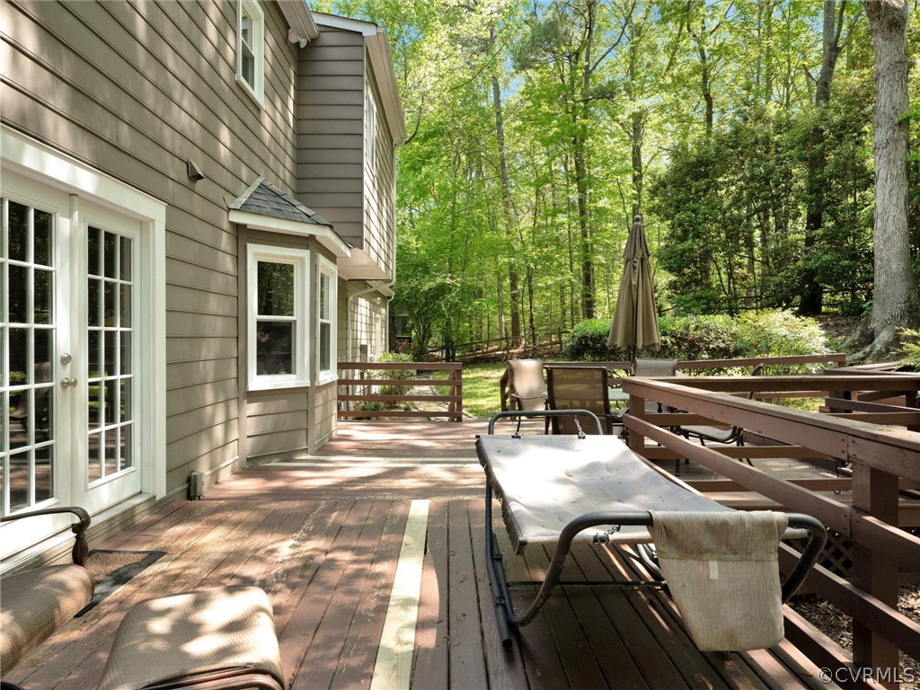 14307 Long Gate Road Midlothian, VA 23112 - Photo 32 of 41 a view of a patio with table and chairs with wooden floor and fence