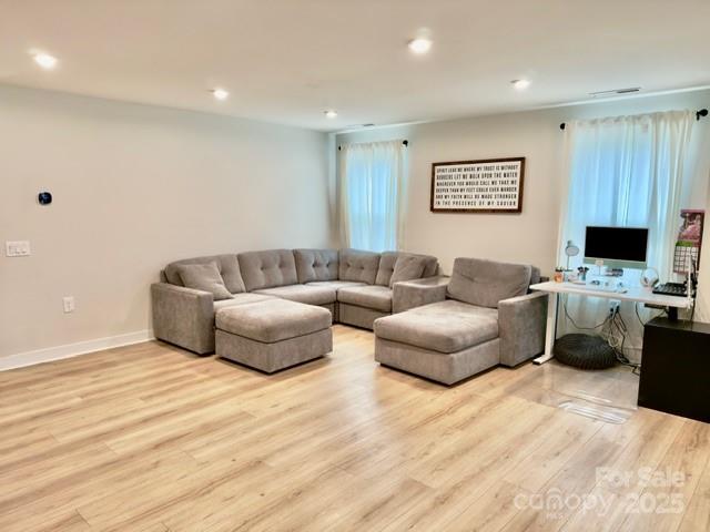 505 Grandiflora Avenue Lancaster, SC 29720 - Photo 7 of 16 a living room with furniture and a flat screen tv